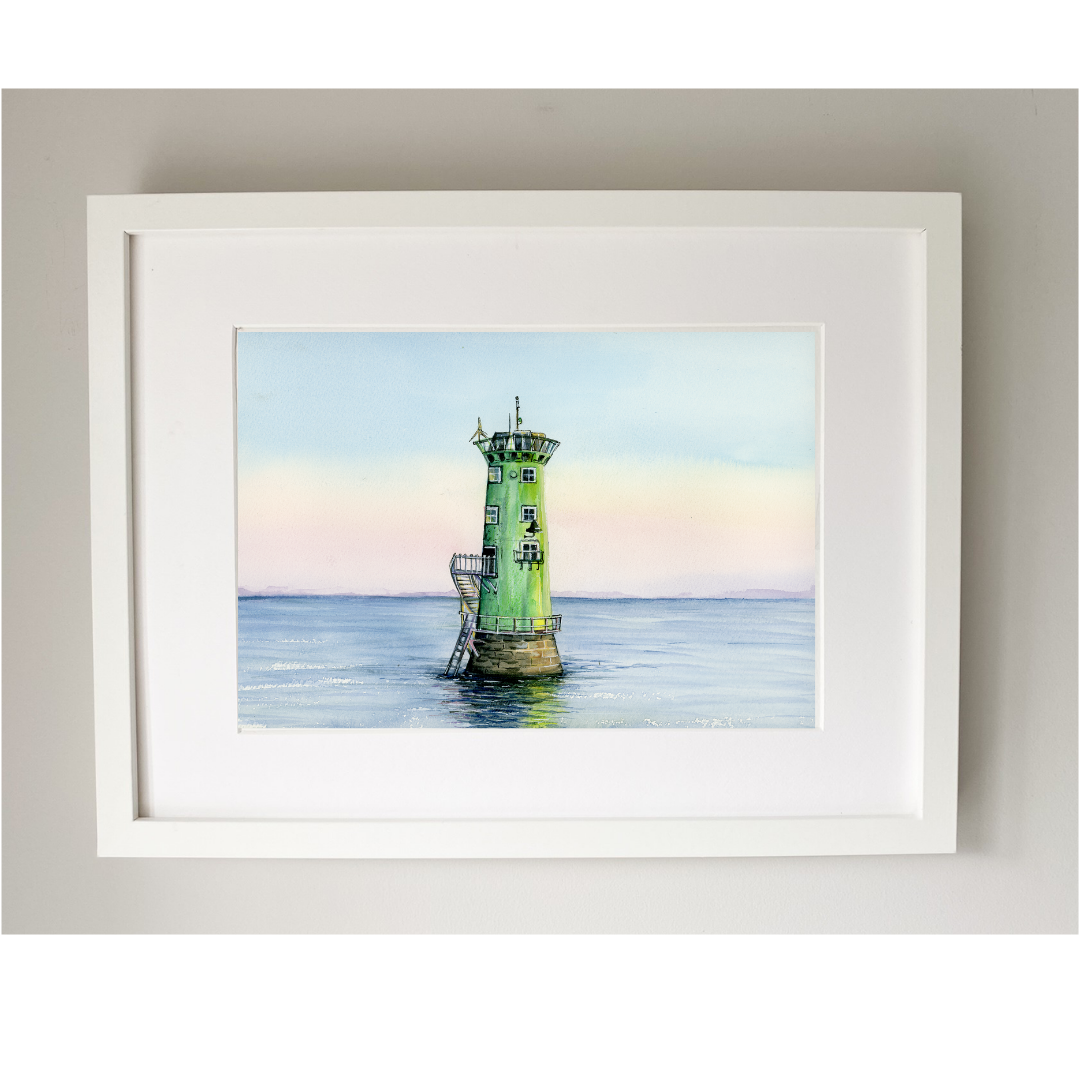 Framed artwork of a lighthouse on water with a white frame.