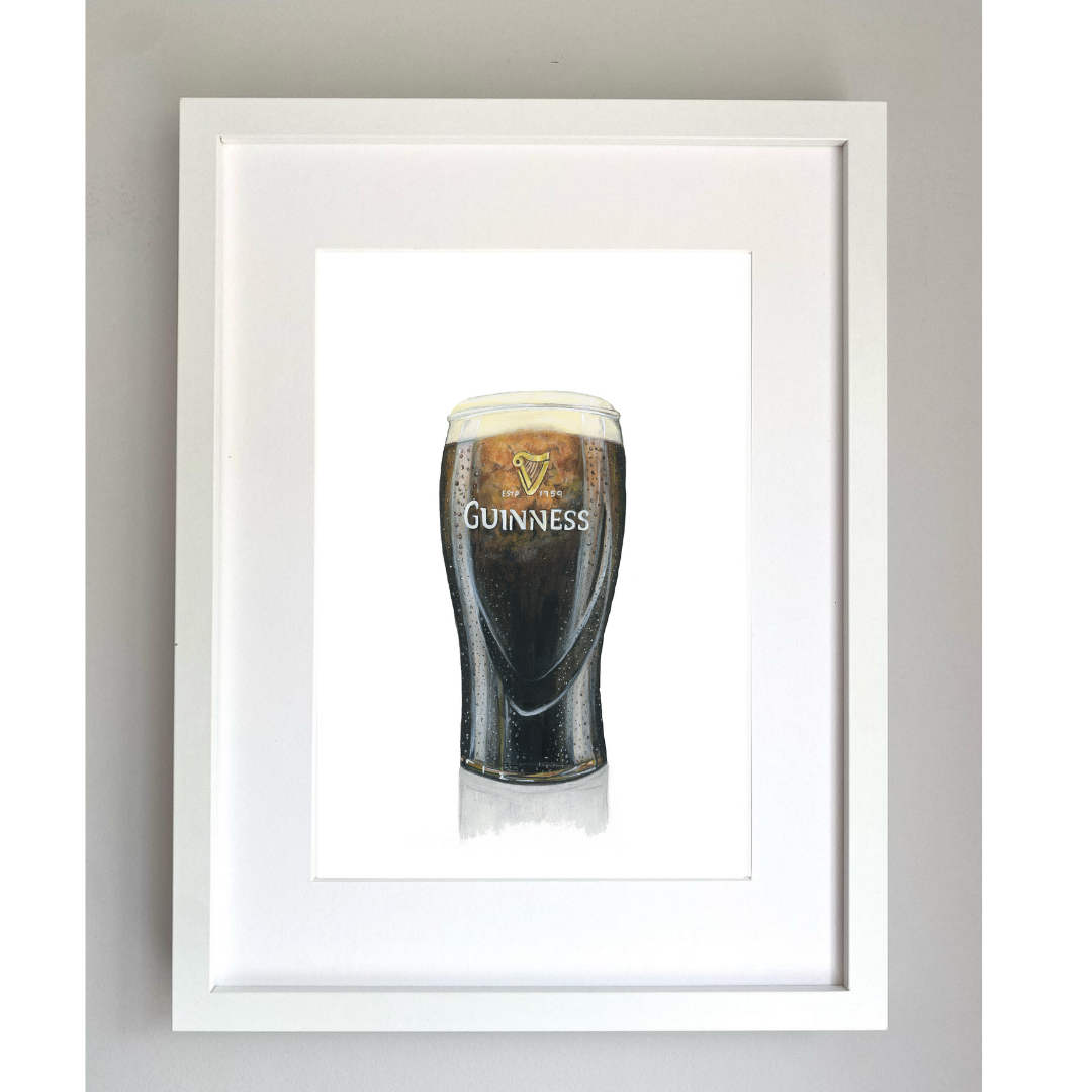 Framed artwork of a pint of Guinness painted in gouache and color pencil, displayed against a white background.