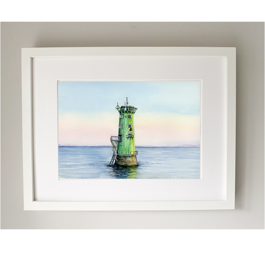 Framed artwork of a lighthouse on water with a white frame.