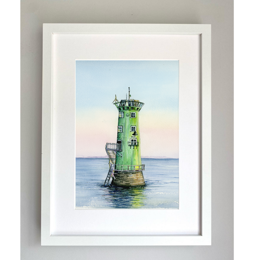 Framed artwork of The North Bull Light house, Dublin Ireland. It is a green lighthouse on water with a white frame.