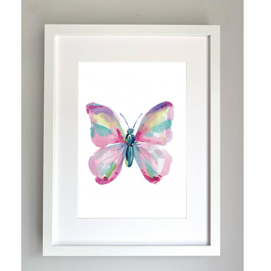 Framed artwork of a pink butterfly painted with watercolour paints on a white background.